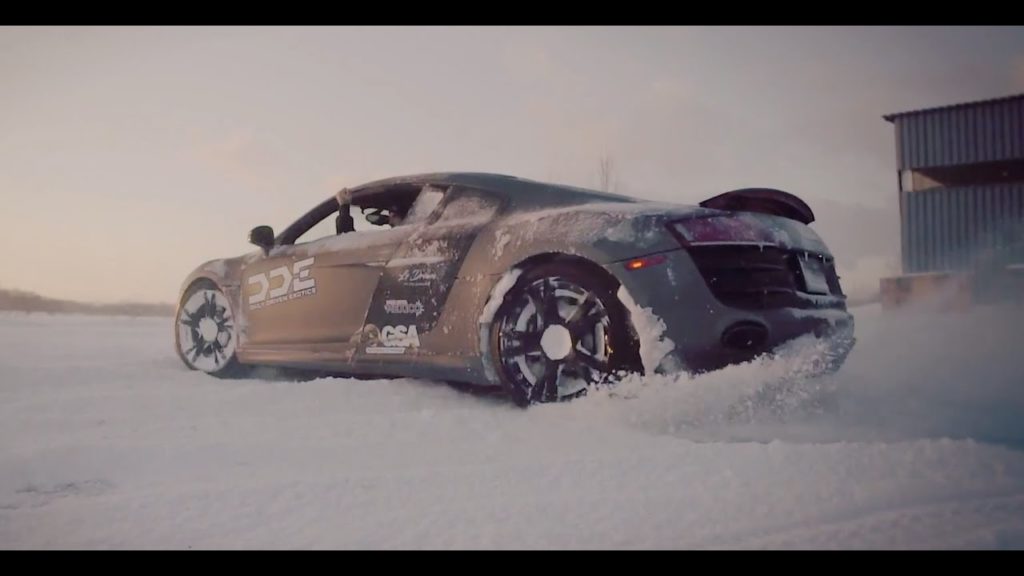 An Audi R8 and a Lamborghini Gallardo playing in the snow