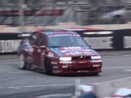 An Alfa Romeo 155 GTA drifting on the track An Alfa Romeo 155 GTA drifting on the track