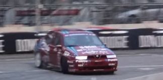 An Alfa Romeo 155 GTA drifting on the track An Alfa Romeo 155 GTA drifting on the track